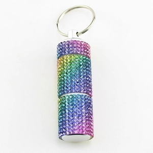 Regenbogen-Strass-Pillendose als Schlüsselanhänger mit vertikalem Kristallzylinder