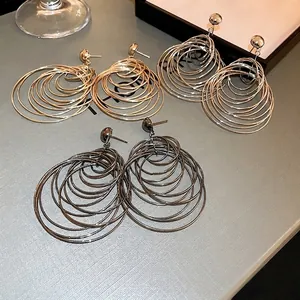 Exaggerated multi-layer hoop earrings in gold silver and black gunmetal finishes