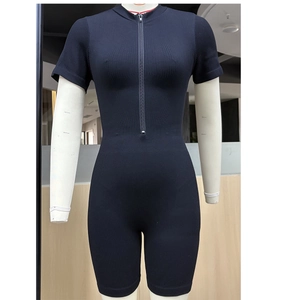 Front detail of black seamless ribbed knit bodysuit with zipper closure and stand collar