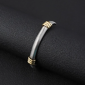 Detail of 6mm stainless steel flat snake chain bracelet with gold bead accents