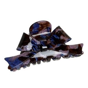 Large acetate bow hair claw clip with blue and purple marble texture for elegant hairstyles