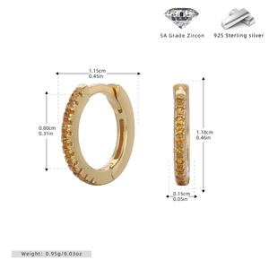 Macro detail showing dimensions of s925 silver hoop earrings with yellow zircon stones