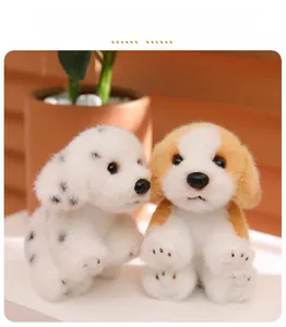 Detail of plush puppy keychains in spotted and golden coats on a soft surface