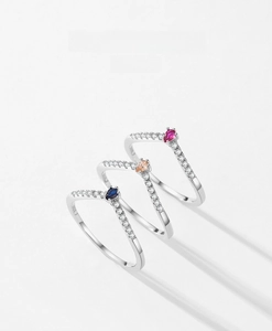 Detailed view of three V-shaped S925 silver rings with colorful pear-shaped zircons