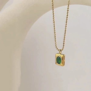 Golden ball chain necklace with a rectangular emerald zircon pendant for women