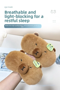 Detail of plush Capybara sleep mask with frog decoration and soft breathable fabric
