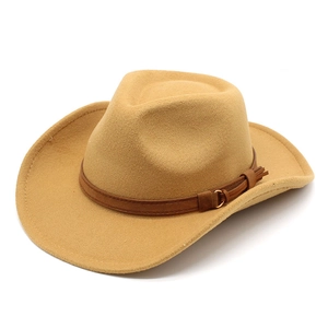 Detail of camel wool fedora hat featuring a brown leather band and metal buckle accent