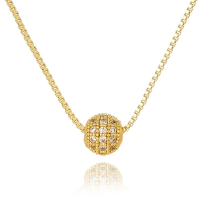 Close-up of golden box chain necklace with a spherical pendant paved in sparkling zircons