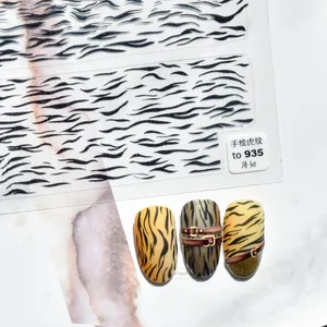 Macro view of hand-drawn black tiger stripe nail stickers with thin and durable texture