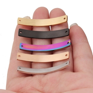 Detailed view of curved stainless steel connector bars in five metallic colors with small holes