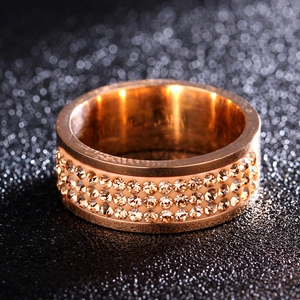 8mm gold titanium steel ring with rows of sparkling crystals on black background
