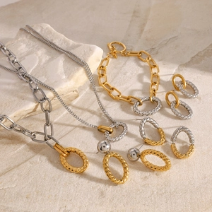 Two-tone gold and silver twisted chain jewelry set with necklaces, bracelet, and earrings