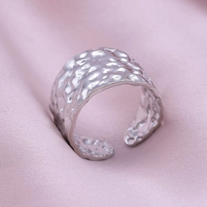 Detail of wide adjustable 304 stainless steel ring with unique hammered texture