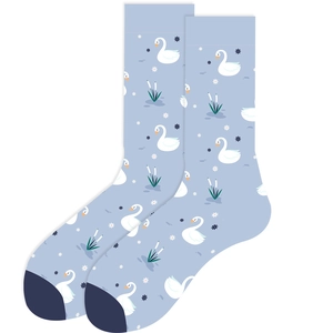 Detail of light blue crew socks featuring cute white swan and floral patterns on white