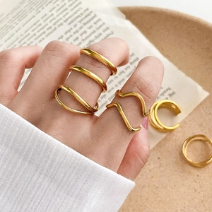 Minimalist double layered gold twisted wave ring for women with polished finish