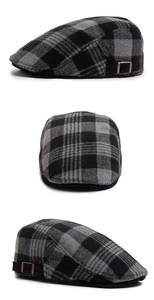Detail view of winter wool blend newsboy cap with classic grey plaid and metal side buckle