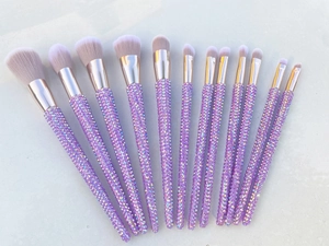 Detail view of 12pcs purple rhinestone makeup brushes with soft pink bristles