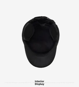 Detail of warm black winter hat interior featuring soft fleece lining and ear flaps