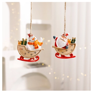Detail of hand-painted resin snowman and Santa figurines in a festive sleigh ornament