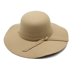 Detailed view of khaki wool felt fedora with matching ribbon trim and elegant side knot