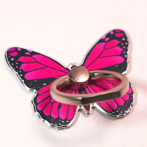 Close-up of pink butterfly phone ring holder with gold metal rotatable stand