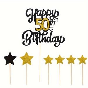 Macro detail of Happy 50th Birthday cake topper set with black and gold glitter stars