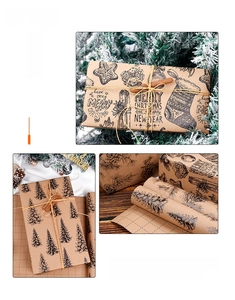Detail of vintage brown kraft Christmas gift wrap with black pine tree and snowflake patterns