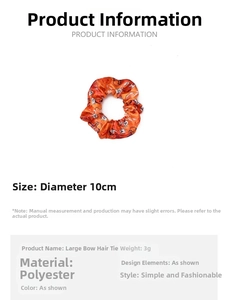 Detailed size and material specification for the orange Halloween pumpkin scrunchie