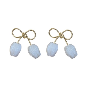 Elegant gold bow earrings with white tulip flower charms and sterling silver pins