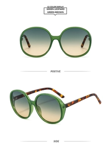 Front and side views of oversized round green sunglasses with leopard print temples