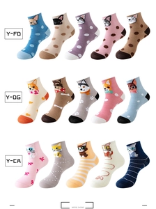 Flat lay of colorful cartoon dog and cat patterned cotton mid-calf socks for men and women