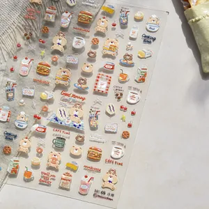 Macro detail of 3D puffy coffee bear stickers showing embossed texture and dessert motifs