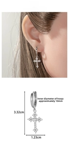 Detail of silver cross huggie earring with micro-pave zircons and 10mm inner diameter