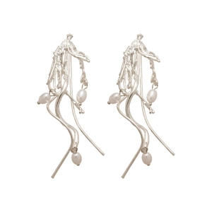 Irregular silver tassel earrings with elegant white pearls in an artistic branch design