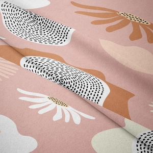 Close-up of bohemian tapestry fabric showing white daisies and soft caramel leaf patterns