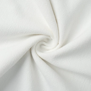 Close-up of white textured fabric with wavy patterns for sleeveless skirt sets