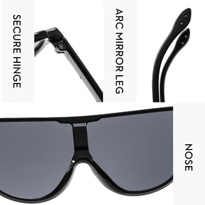 Detail view of reinforced metal hinges and ergonomic arc temples of black oversized sunglasses