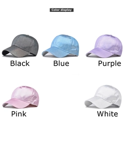 Detailed color display of five shiny glitter baseball caps in black, blue, purple, pink and white