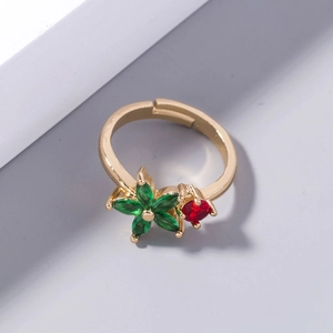 Close-up of golden adjustable ring with five-petal green and red zircon flowers