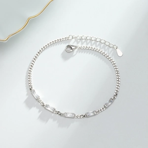 Detailed macro view of S925 sterling silver chain bracelet with square zircon gemstones