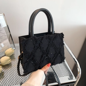 Large capacity black quilted tote bag with fringe texture and leather top handles