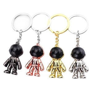 Modern astronaut keychains in gold, silver, rose gold and gunmetal alloy finishes