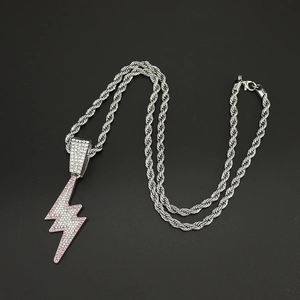 Macro detail of lightning bolt pendant with sparkling pink and white rhinestones