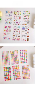 Macro view of long decorative stickers featuring colorful balloons and hearts for journals