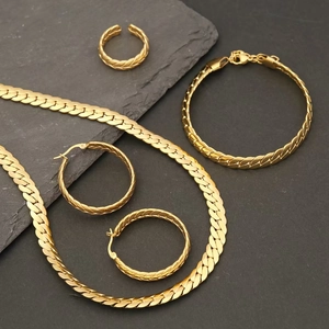 Detailed set of gold snake chain necklace, bracelet, hoop earrings and open ring set