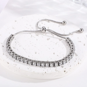 Adjustable titanium steel tennis bracelet with colorful cubic zirconia on white stand