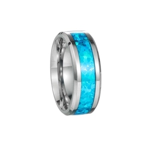 Detail of silver stainless steel ring with vibrant blue opal inlay texture