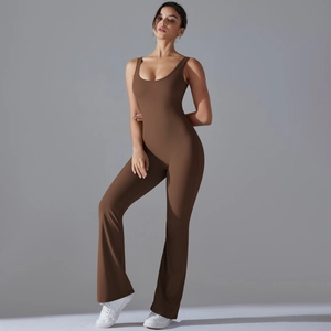 Macro view of wide shoulder straps and fitted bodice on a dark brown yoga jumpsuit