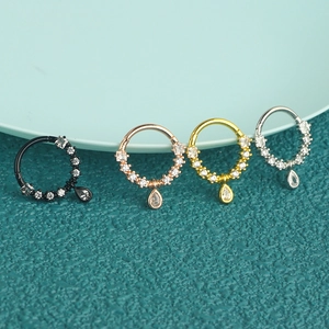 Surgical steel nose rings set with cubic zirconia teardrop pendants in four colors
