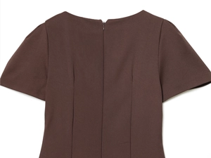 Detail of dark brown short dress featuring back neckline with a hidden zipper closure